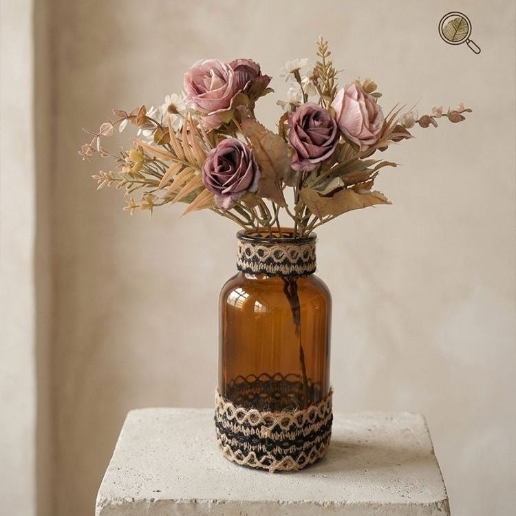 Glass vase with a bouquet of dried flowers
